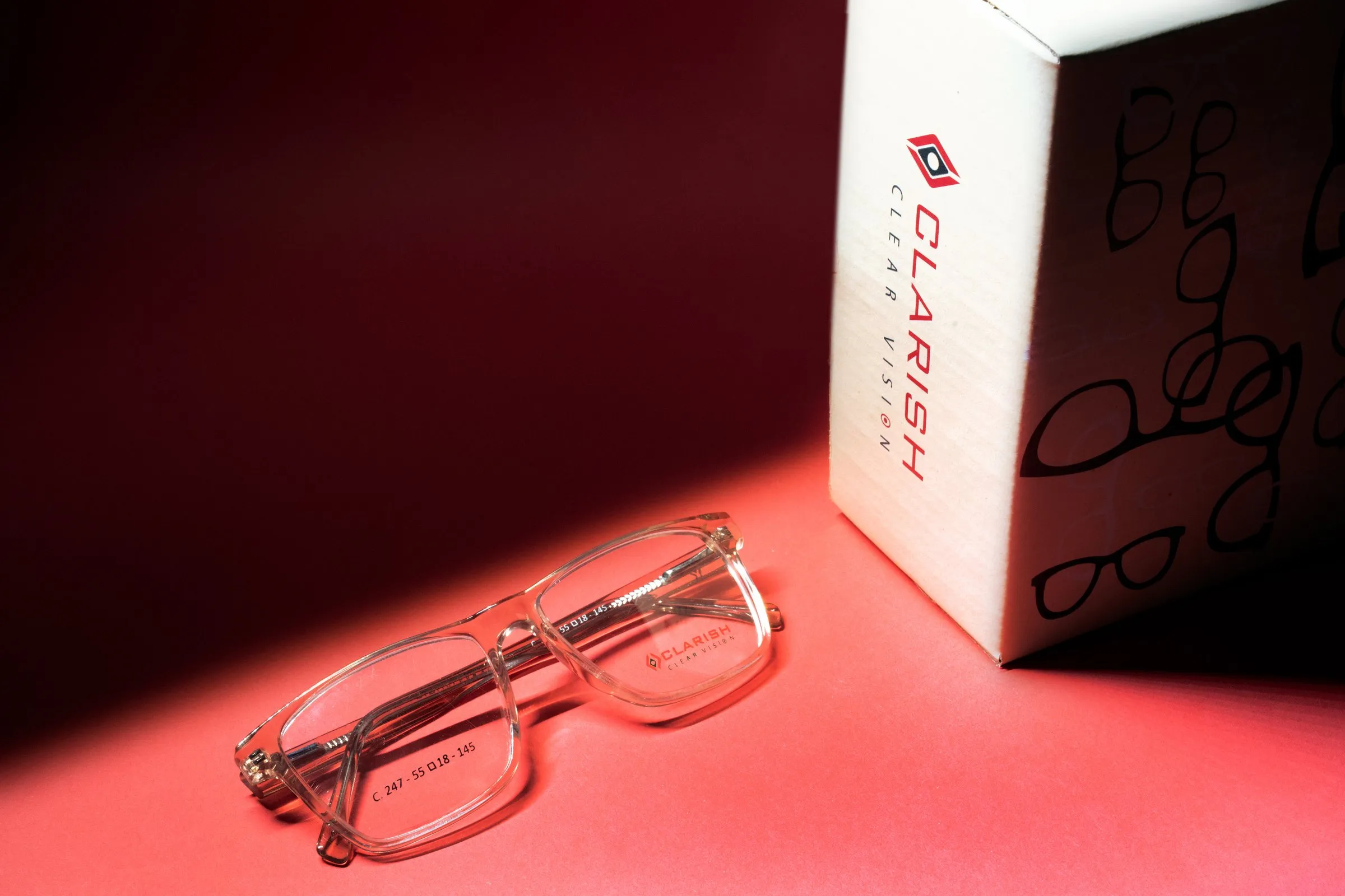 A crystal Clarish™ frame photographed beside its printed retail carton